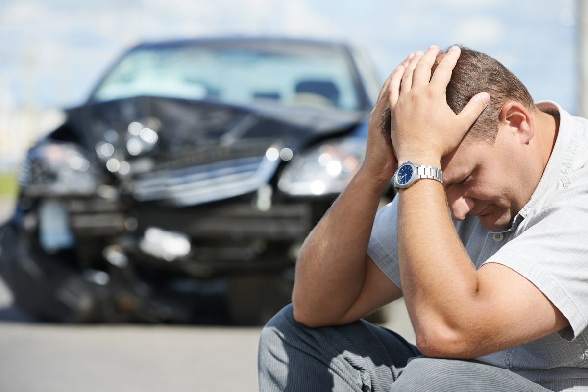 Man with crashed car needing affordable auto insurance in Winona Lake, IN