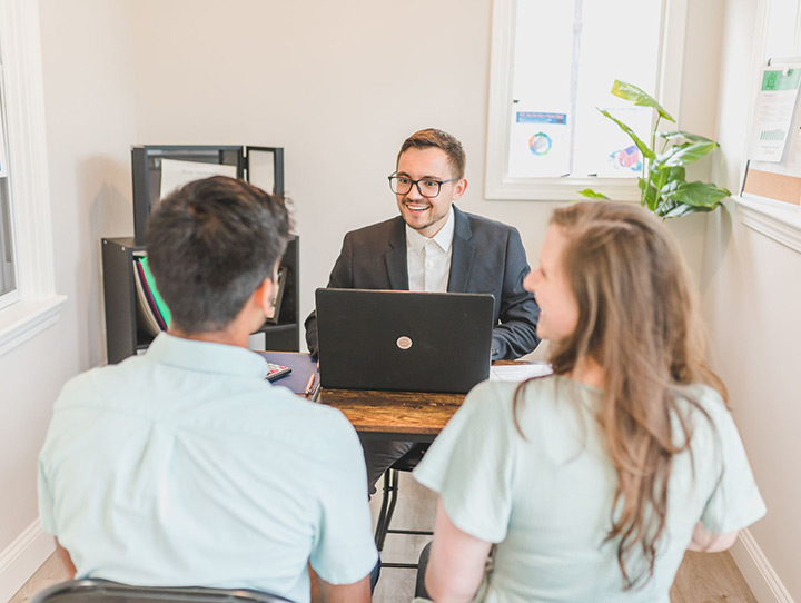 A agent reviewing auto insurance with his clients in Goshen, IN
